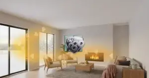 A cozy living room with a fireplace and large sliding glass doors showing a snowy landscape, illustrating how LoE i89 glass reflects heat back into the home.